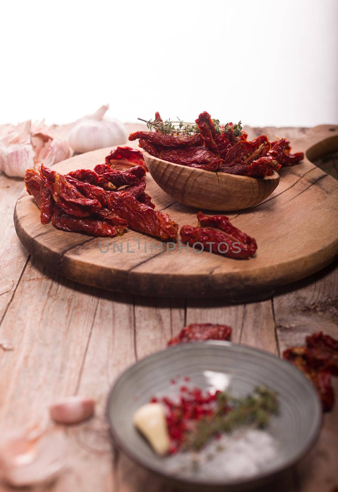 Close up of Mediterranean dried tomatoes on cutting board