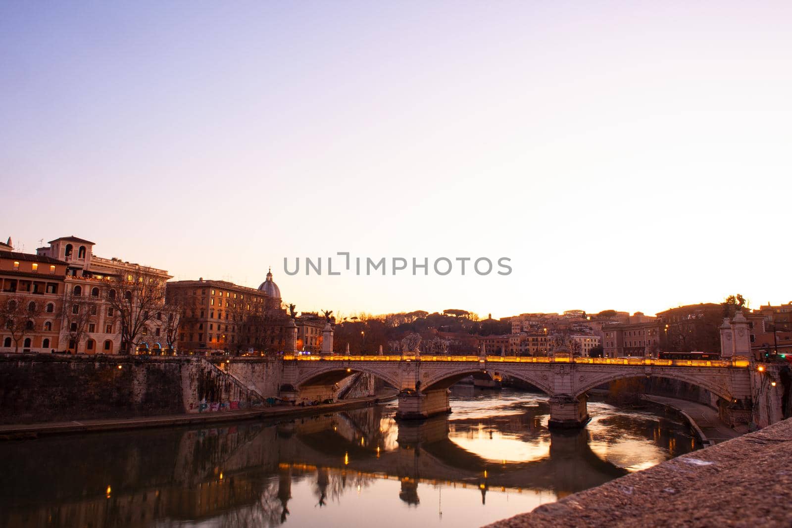 View of Vittorio Emanuele II bridge at sunset in Rome