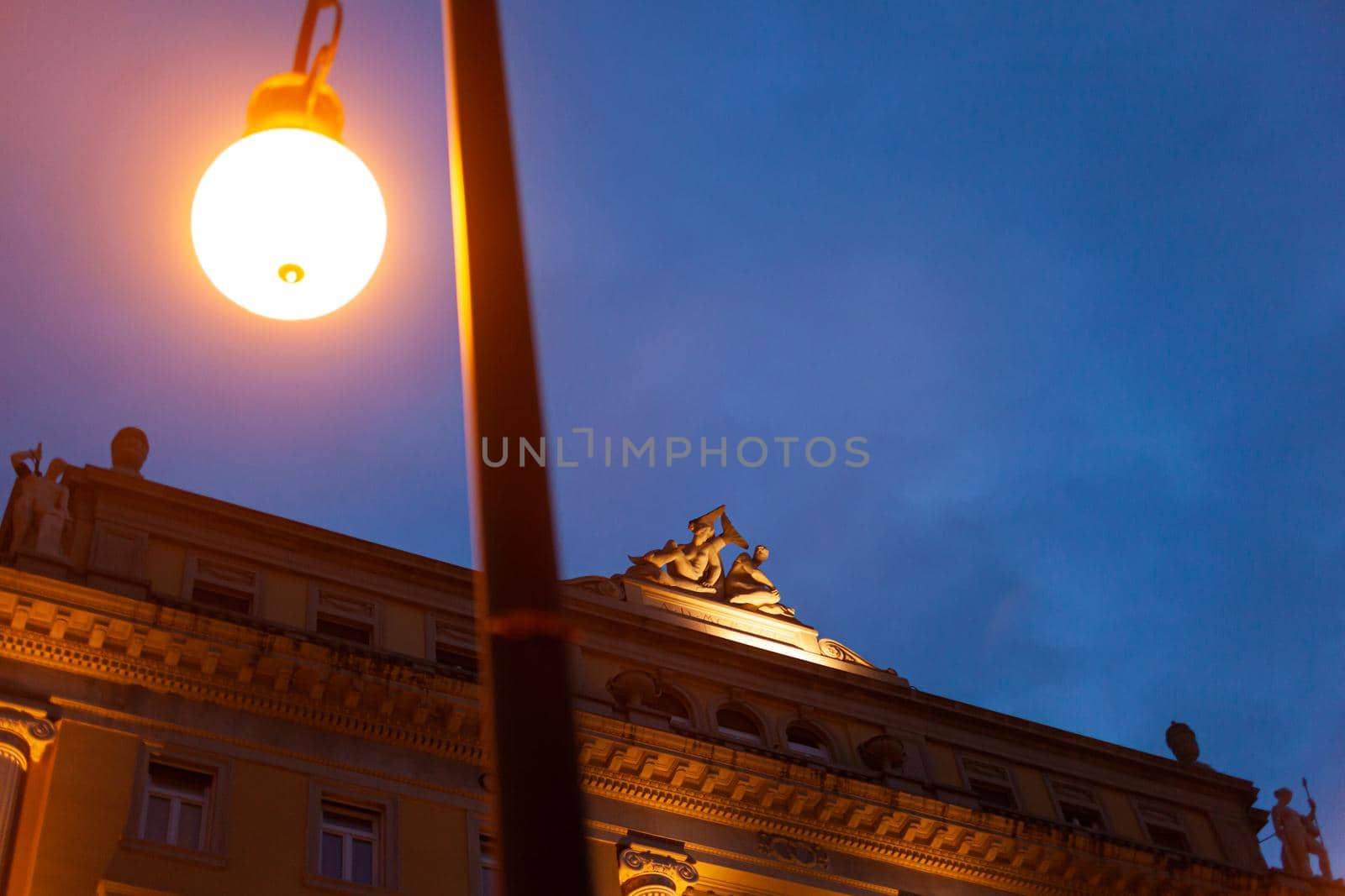 Evening view of a historic building in Trieste, Italy