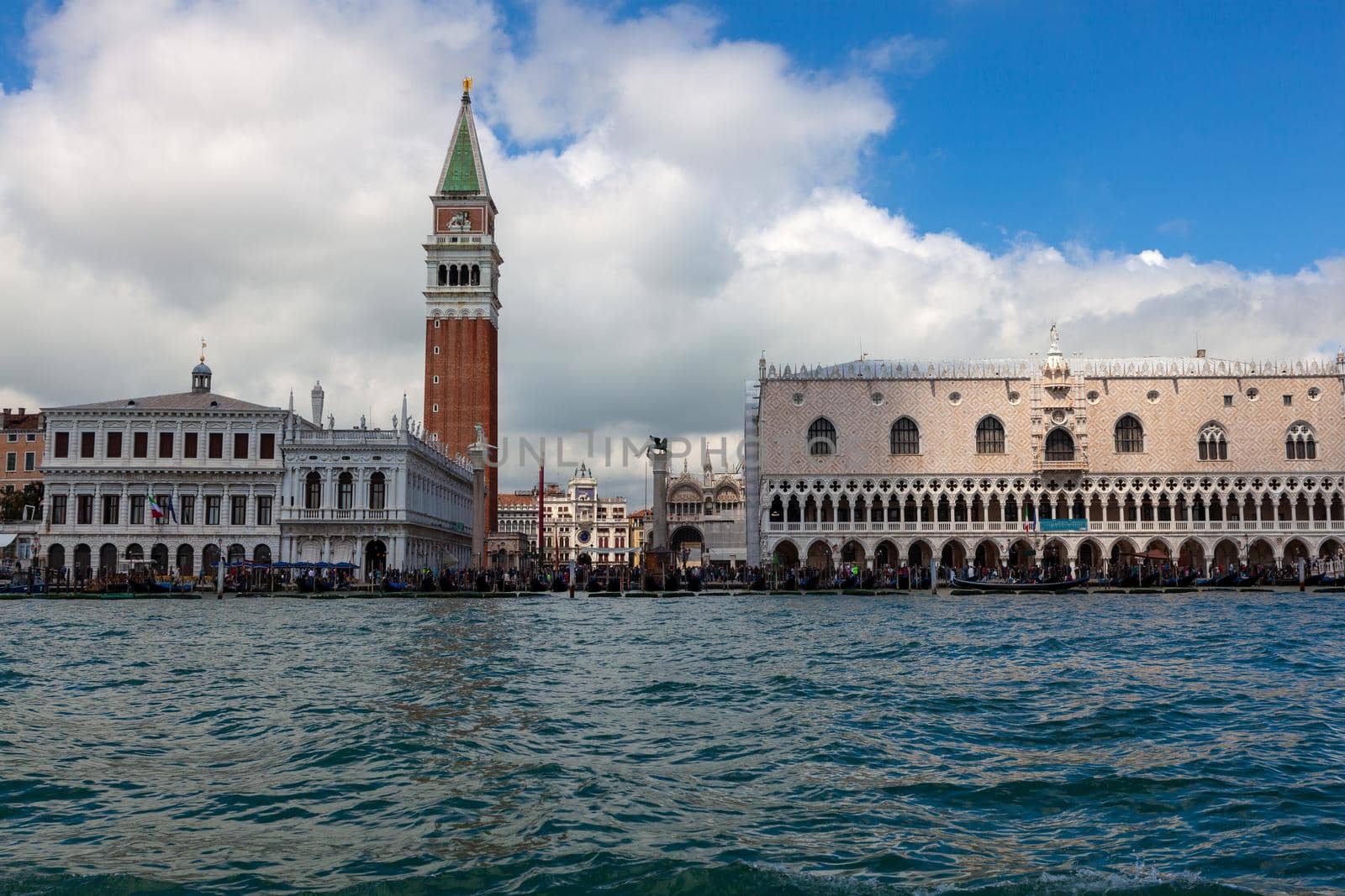 View of the doge palace next to the San Marco bell tower from the Venice lagoon