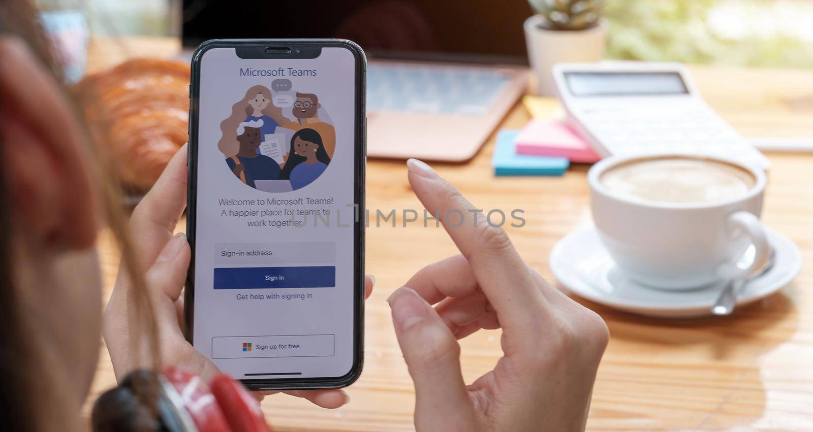 CHIANG MAI, THAILAND - APR 11, 2020 : A working from home employee is downloading the Microsoft Teams social platform, ready for remote working in isolation from home by wichayada