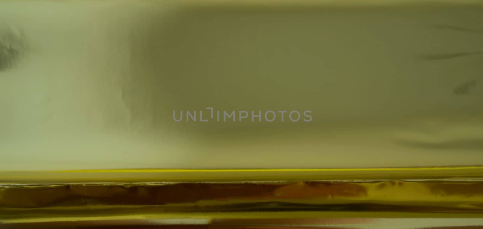Texture, background, gold foil. Golden foil close up.