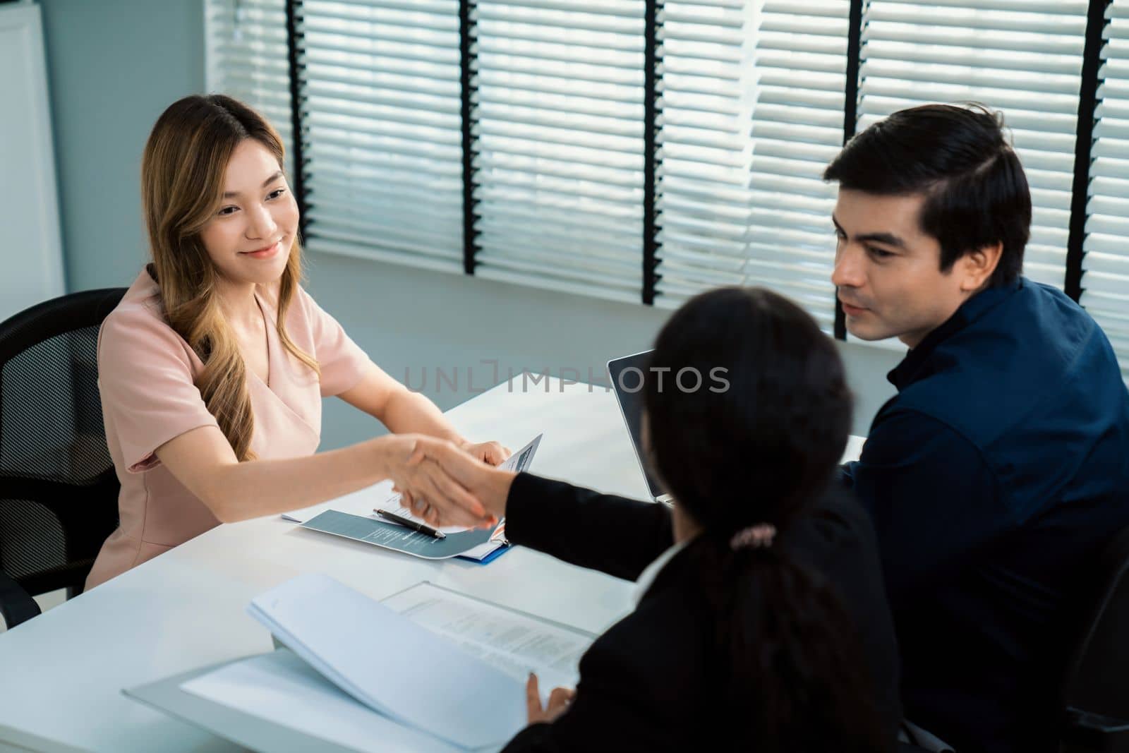 A new and competent female employee successfully interviewed. Newly graduated gets her first job after the interview.