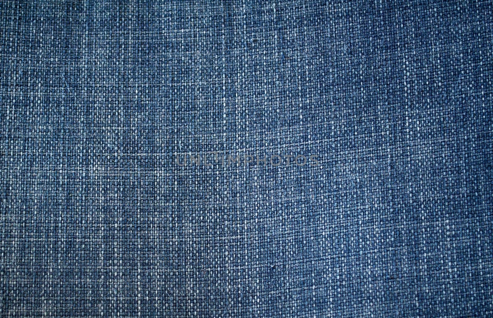 
Background, texture, denim. Close-up photo of blue denim fabric.