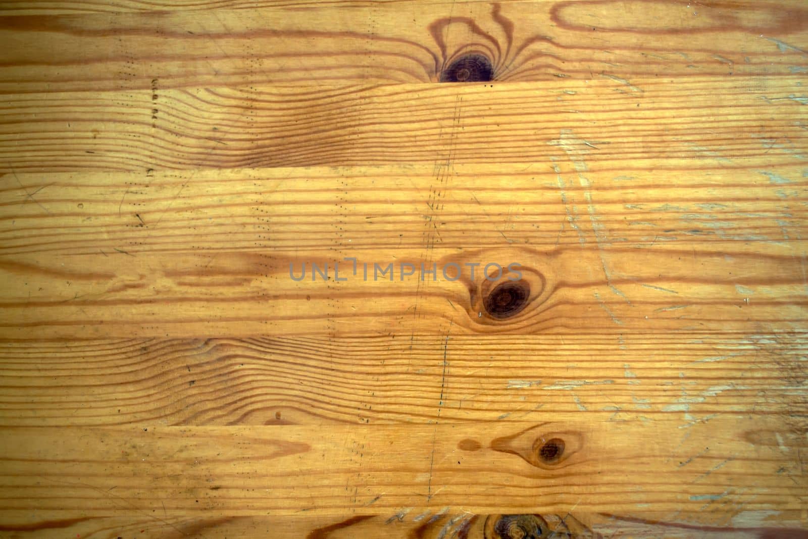 
Background, texture, scratched old wooden table. The wooden surface is old with scratches.