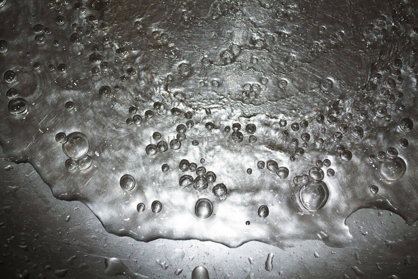 
Background, texture, metal, water drops. Photo of metal, water and air bubbles.