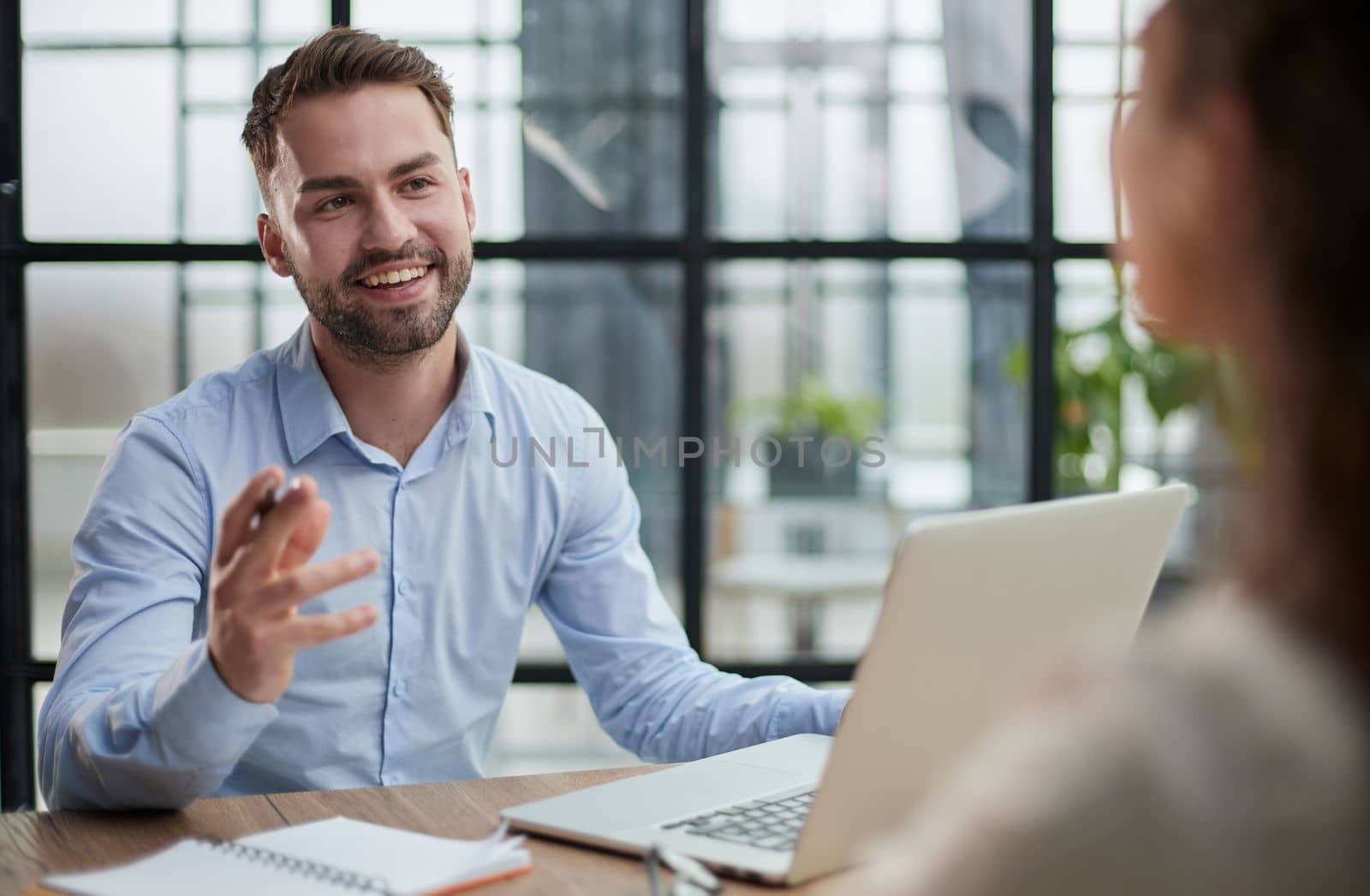 Handsome bearded man in a modern office