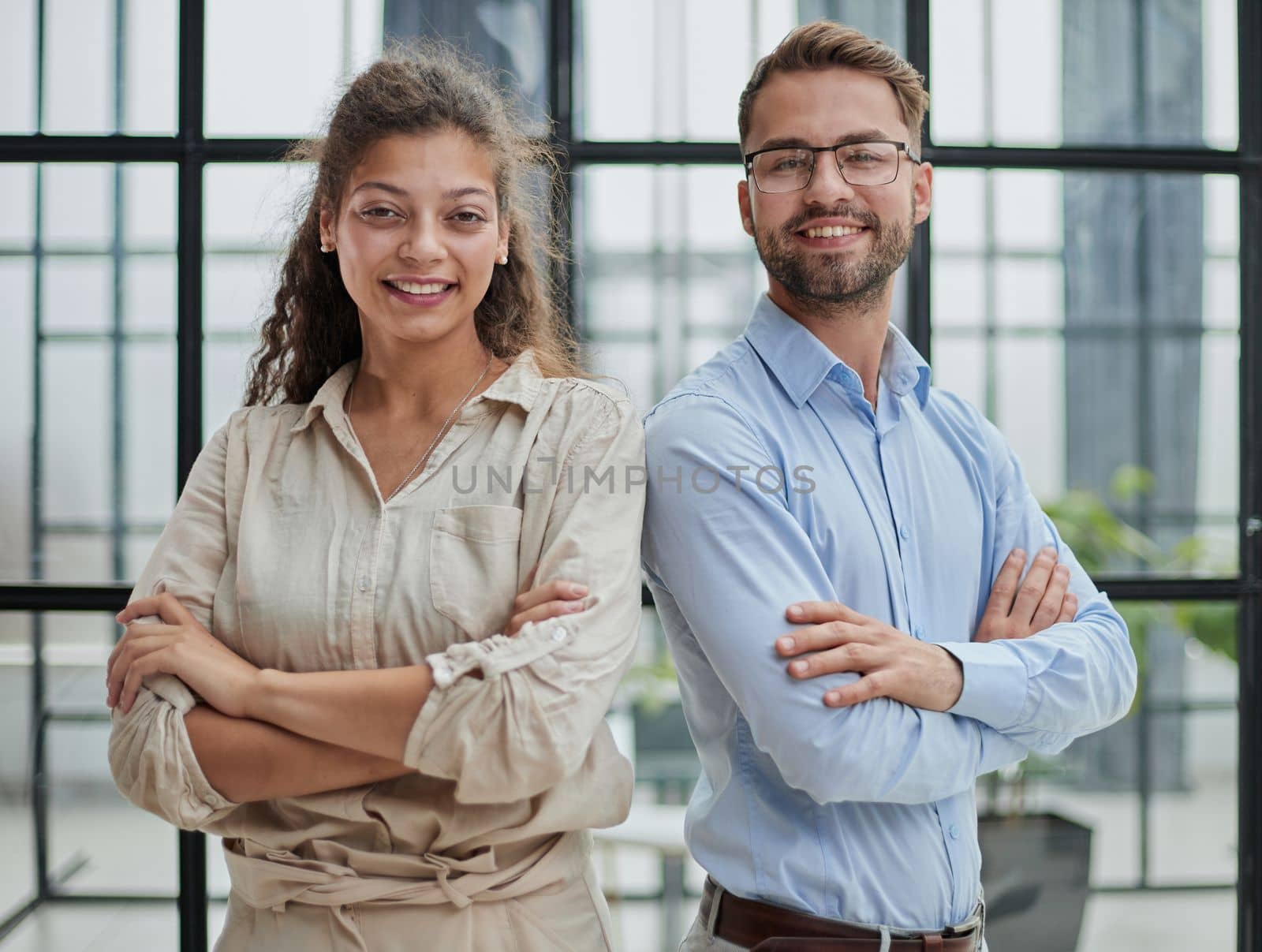 business people in the office arms crossed