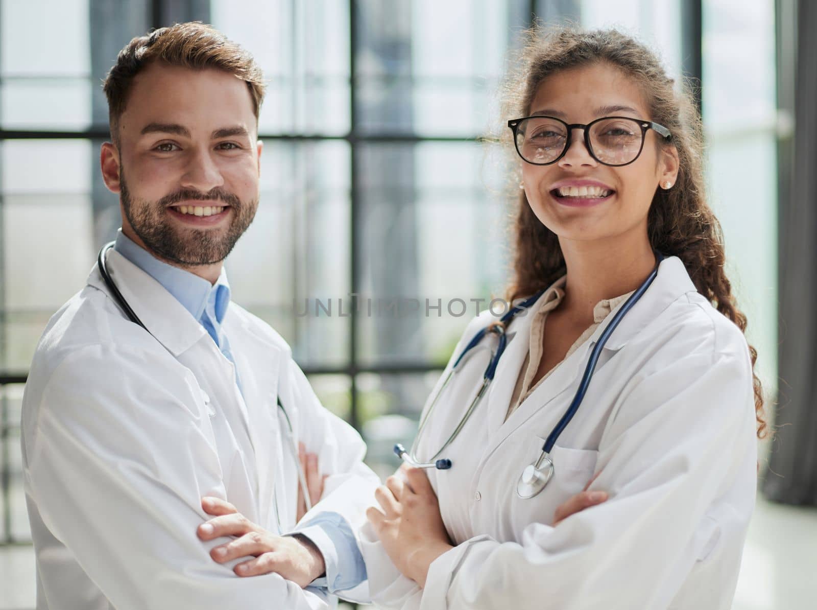 portrait of two medical workers in the hospital looking at the camera