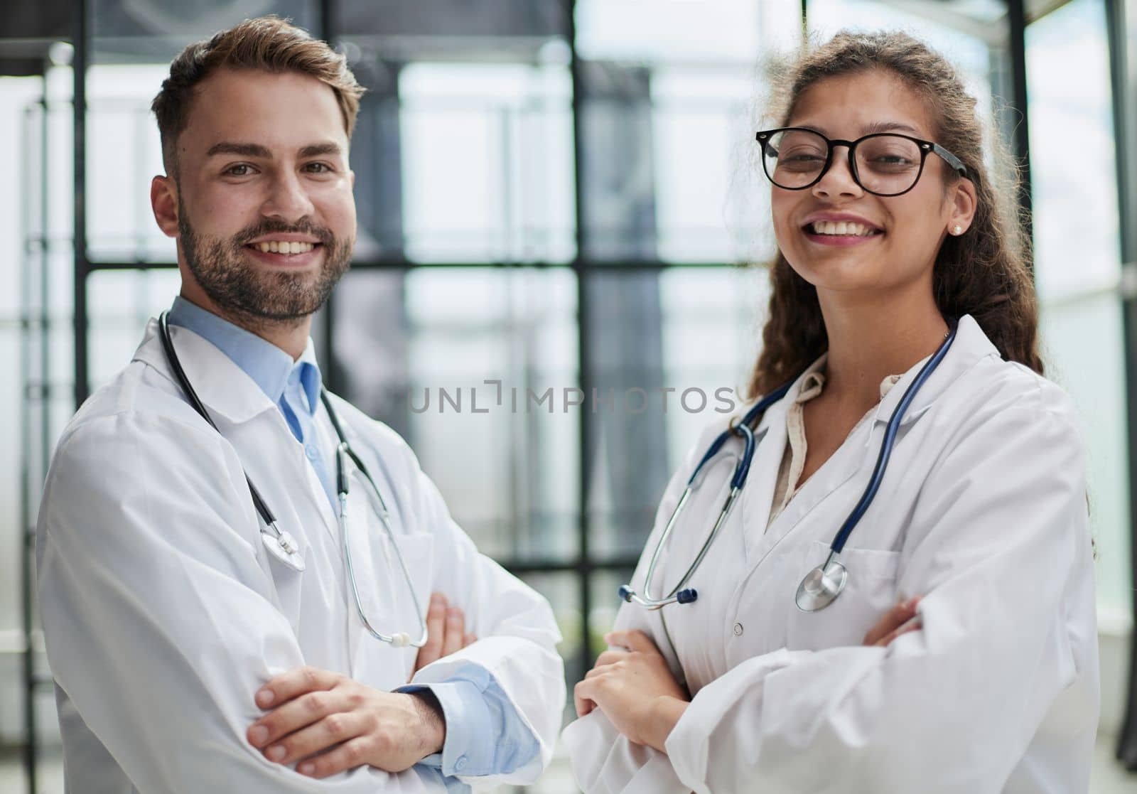 portrait of two medical workers in the hospital looking at the camera