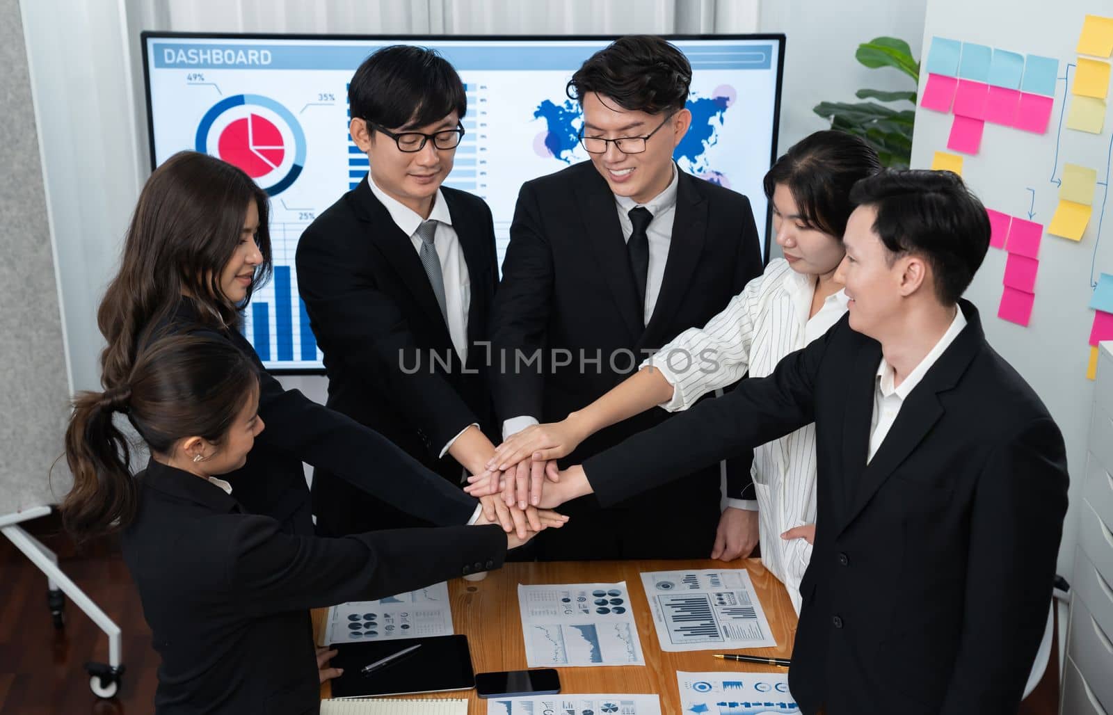 Closeup business team join hand stack together for harmony concept. by biancoblue