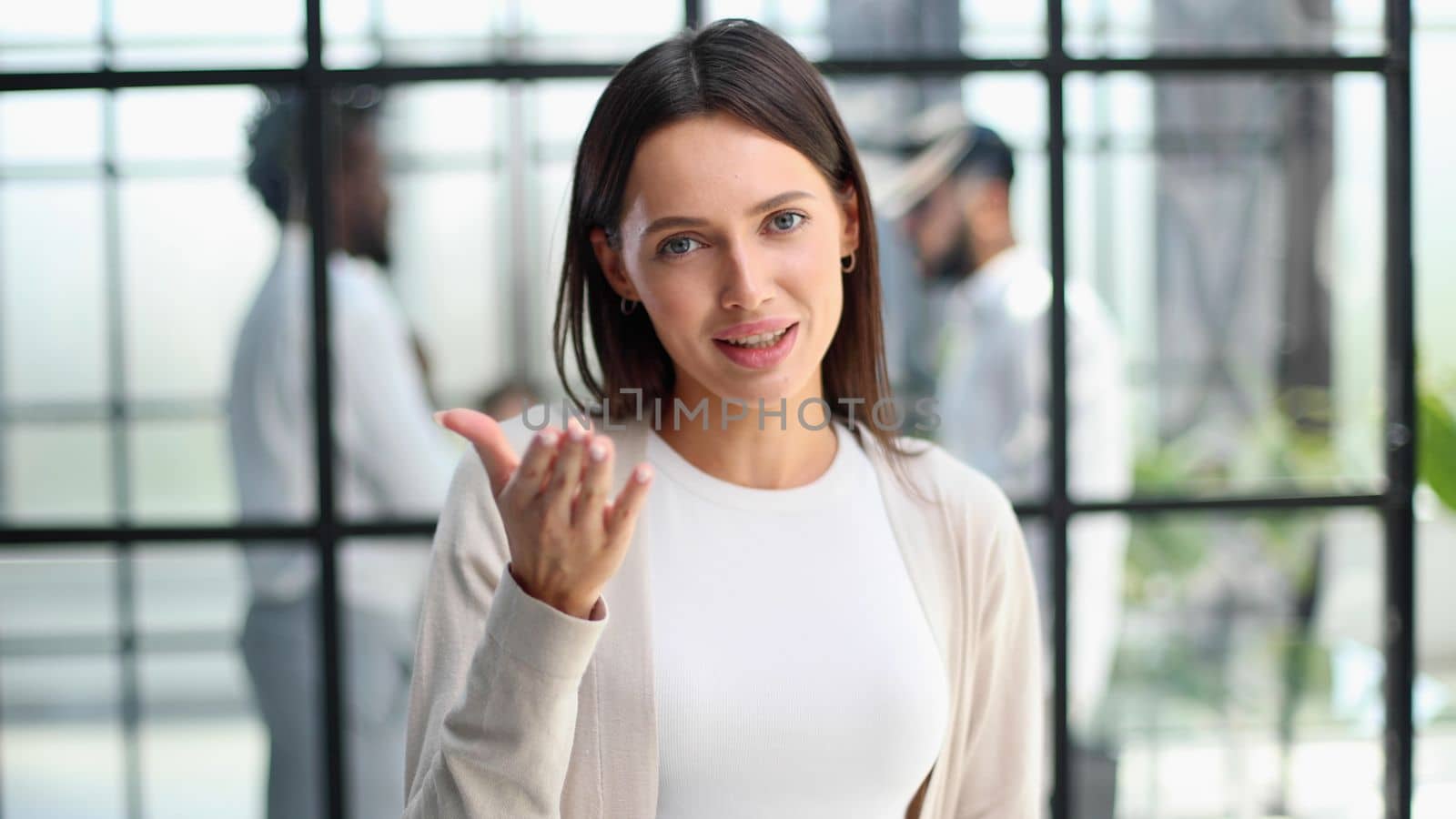 Face of beautiful woman on the background of business people