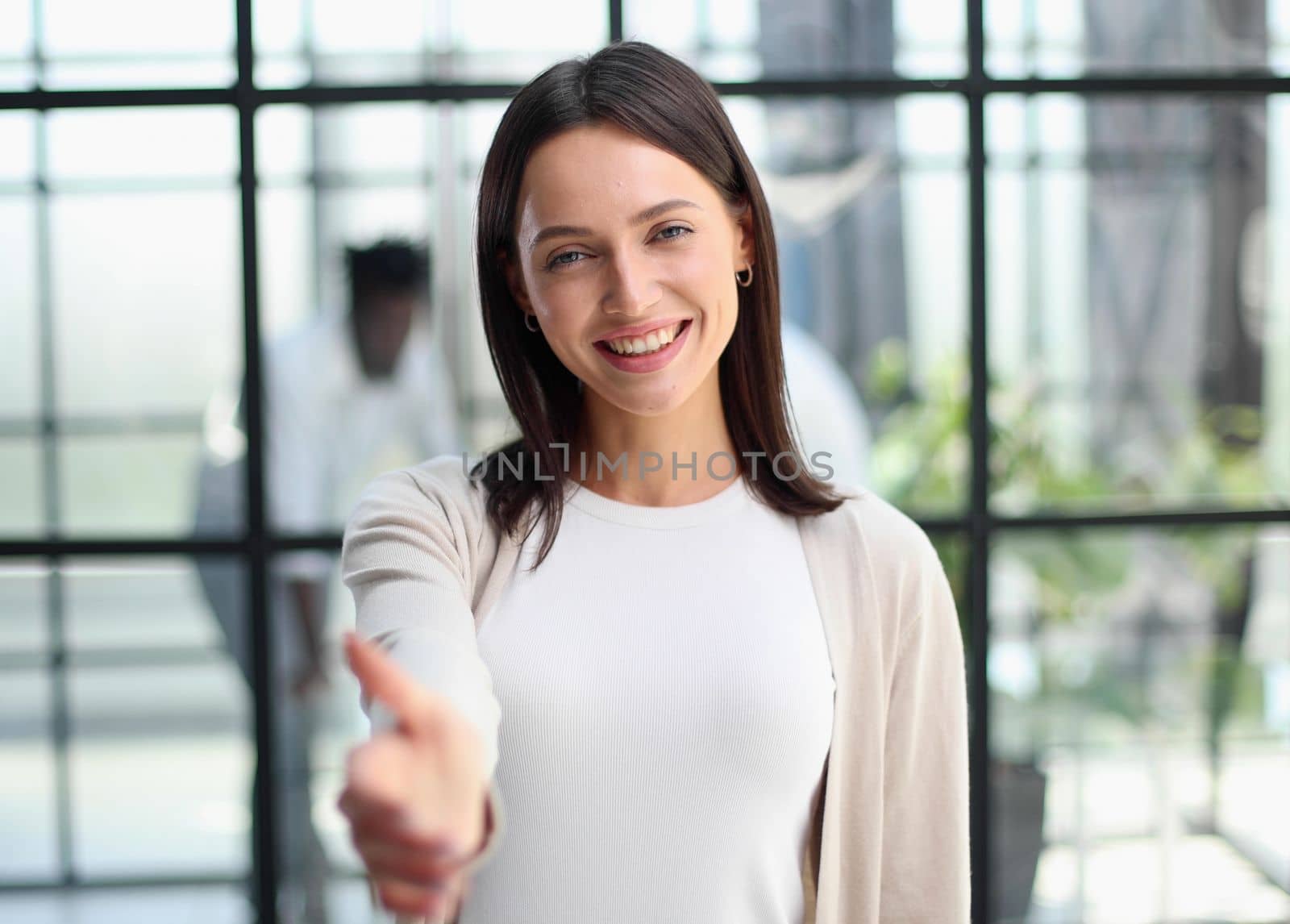 Face of beautiful woman on the background of business people