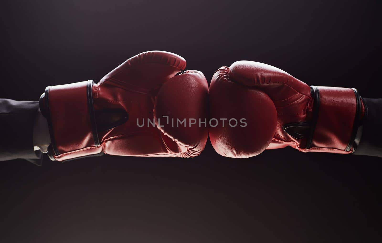Two men's hands in boxing gloves. Confrontation concept by Prosto