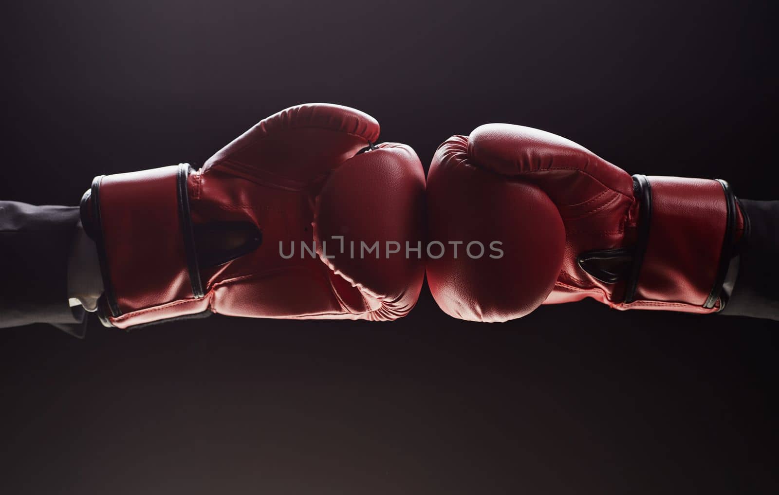 Two men's hands in boxing gloves. Confrontation concept