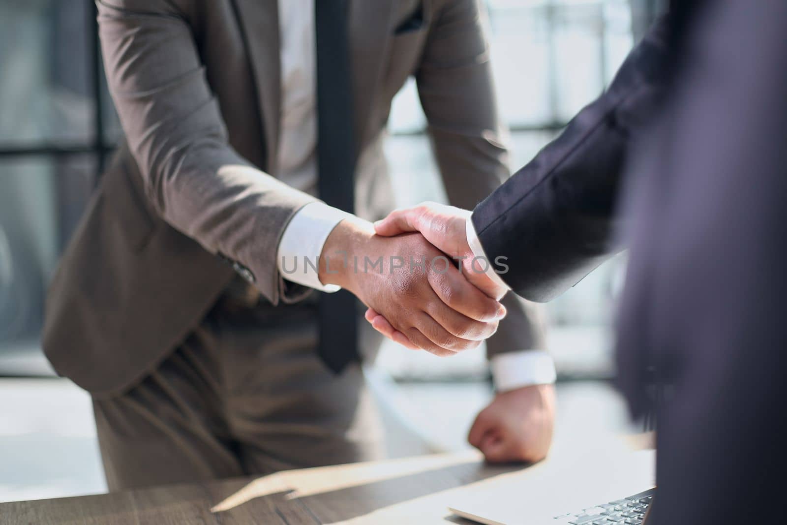 closeup of handshake of business partners by Prosto