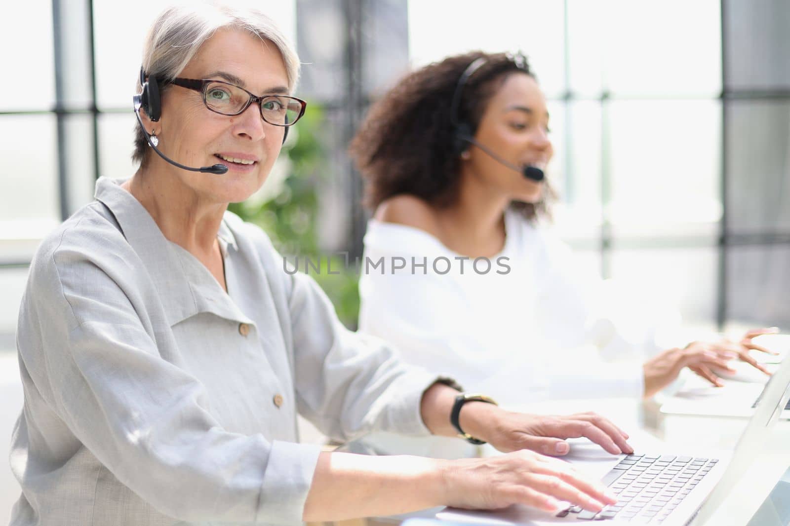 operator woman agent with headsets working in a call centre