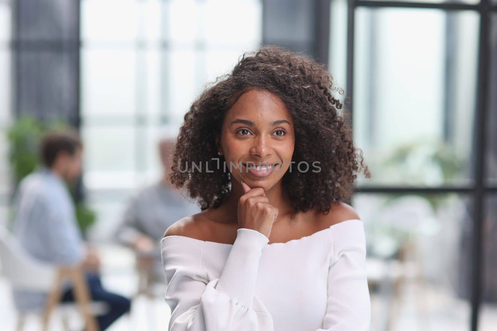 Portrait of an African American young business woman working in the office.