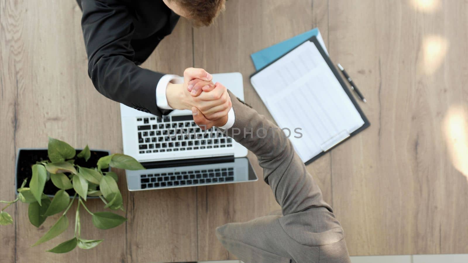 businessmen colleagues shaking hands on meeting in office, diverse enterpreneurs striking good deal by Prosto