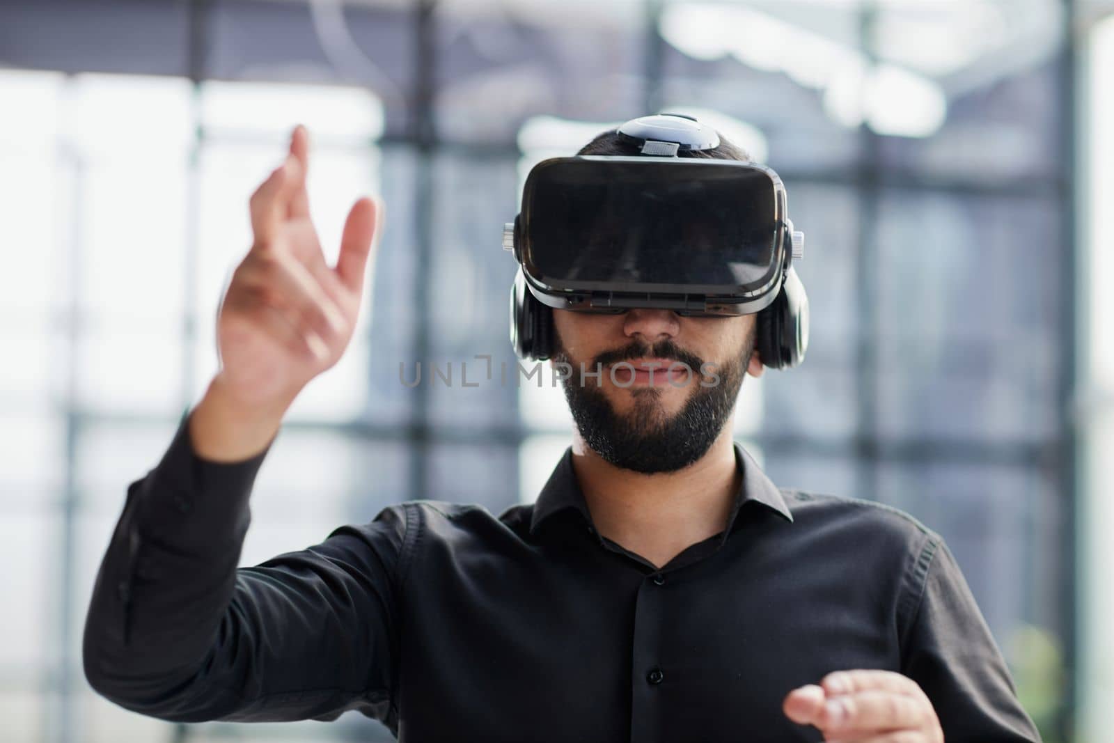 Businessman with virtual reality headset at office