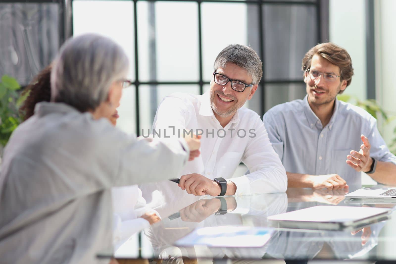 discussion of business people in the office sitting at the table