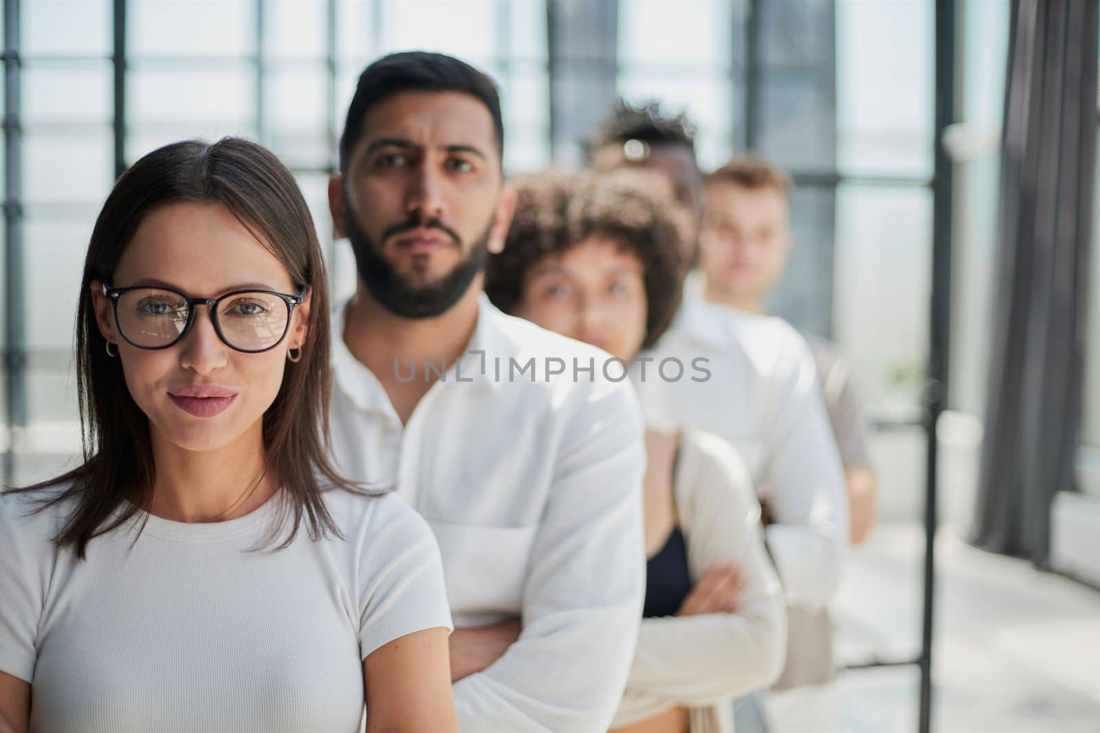 Face of beautiful woman on the background of business people
