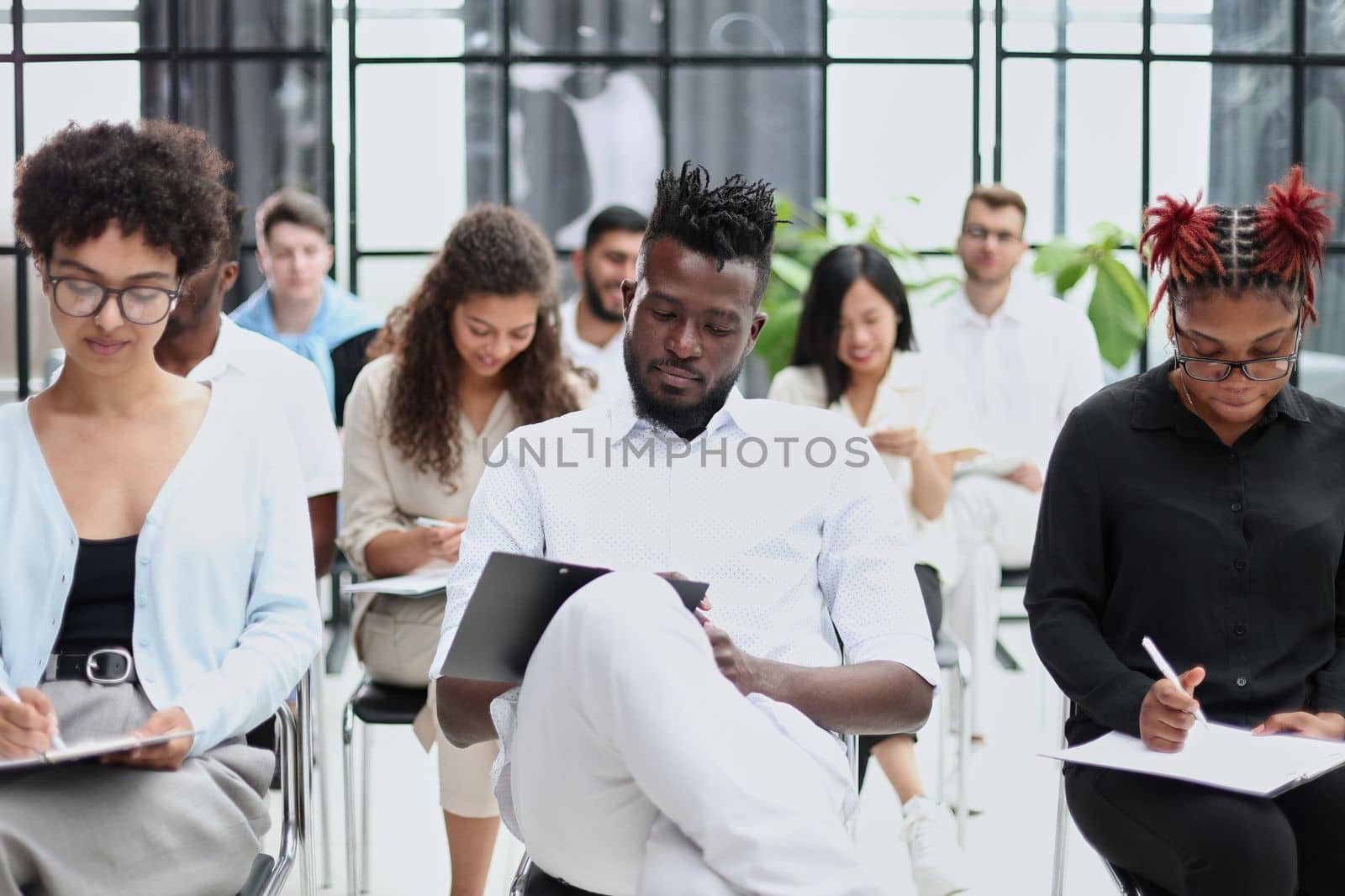 Group of multi-ethnic business people in a seminar