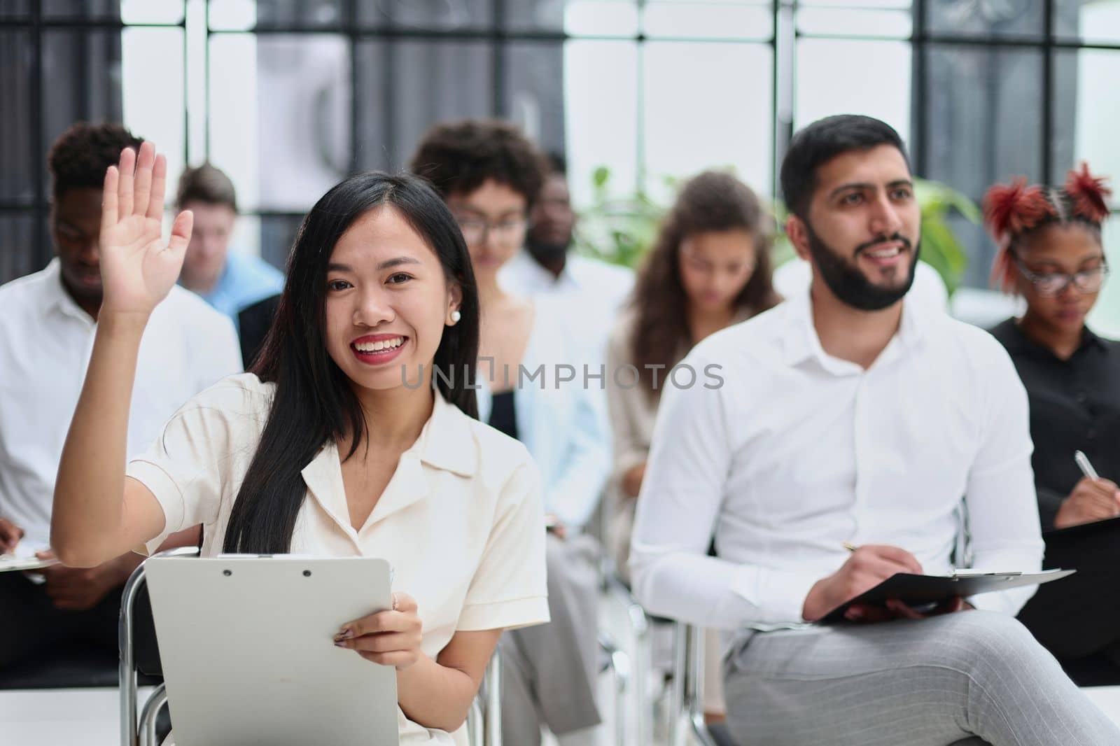 conducts business training with a group of young people.