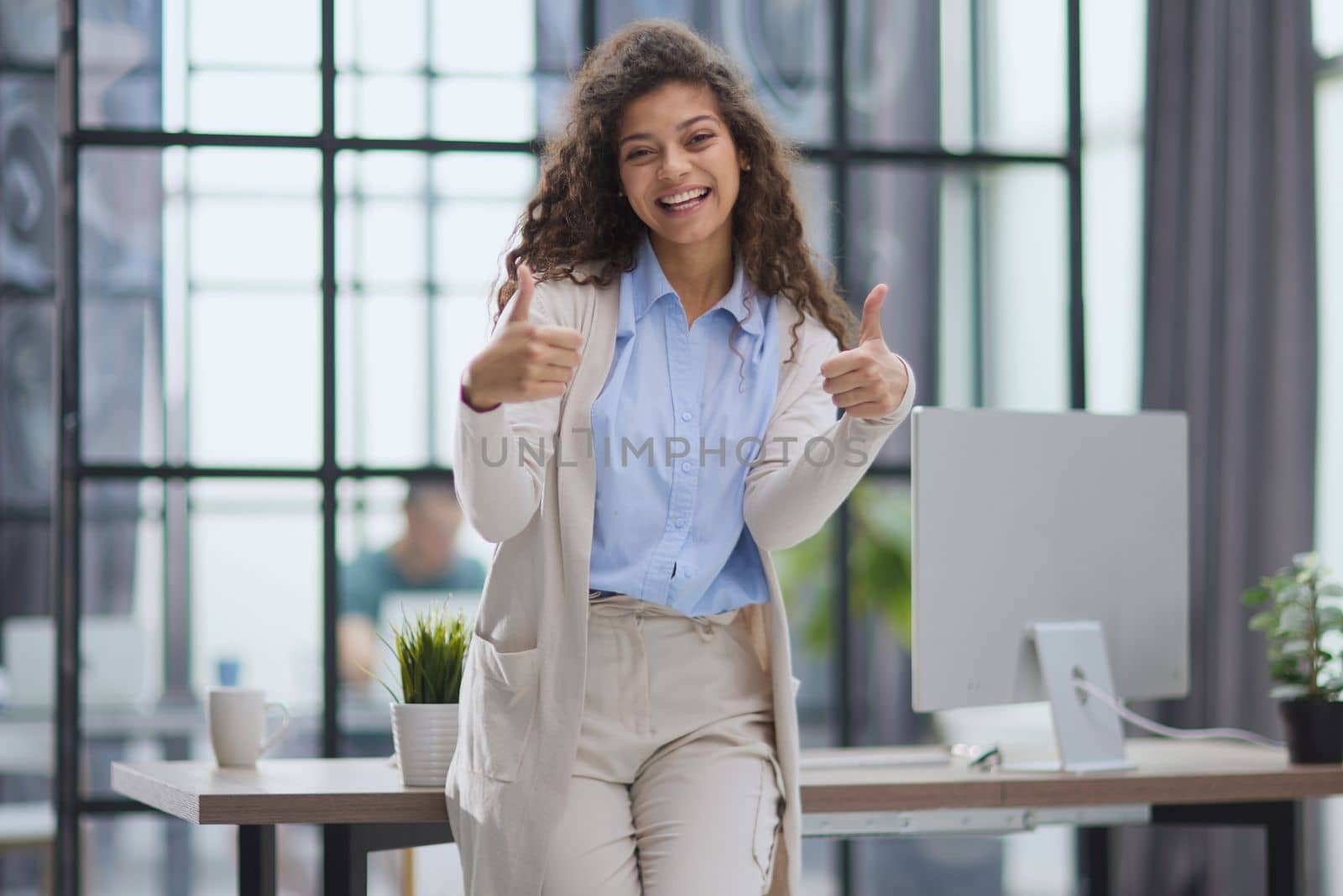 Photo of happy web designer look camera show thumb up