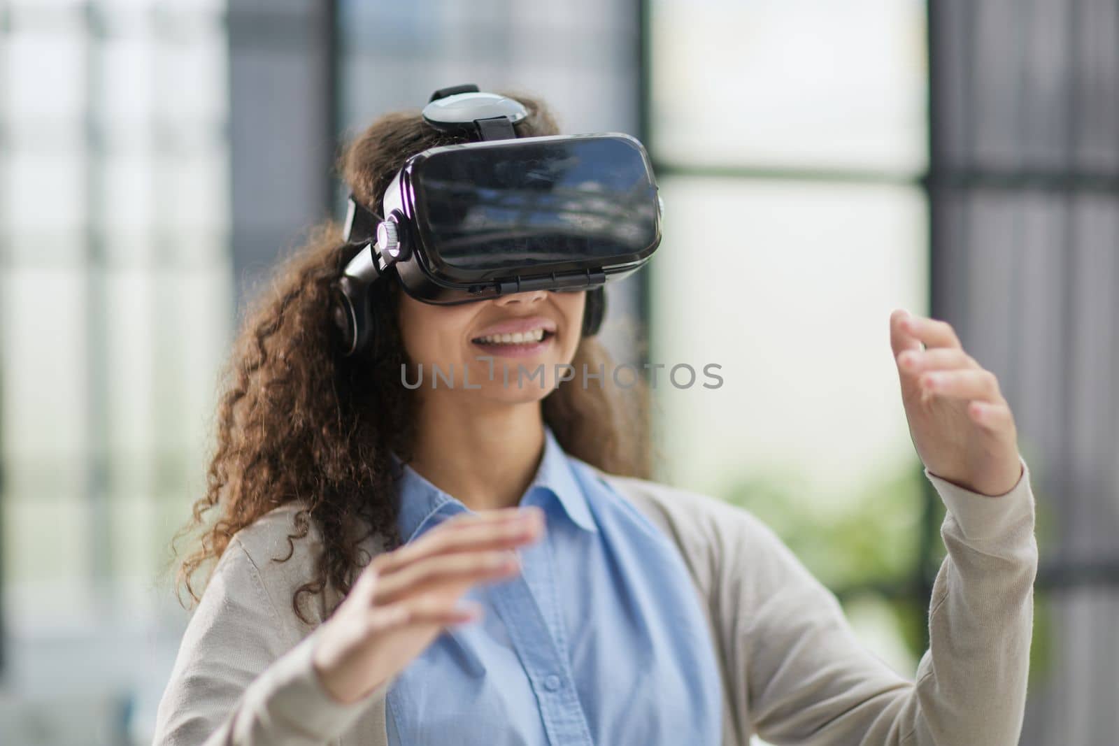 Girl trying to touch objects in virtual reality.