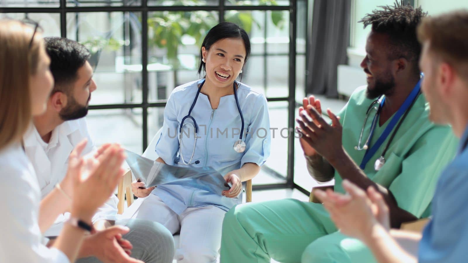 Group of multiethnic doctors looking at x-ray