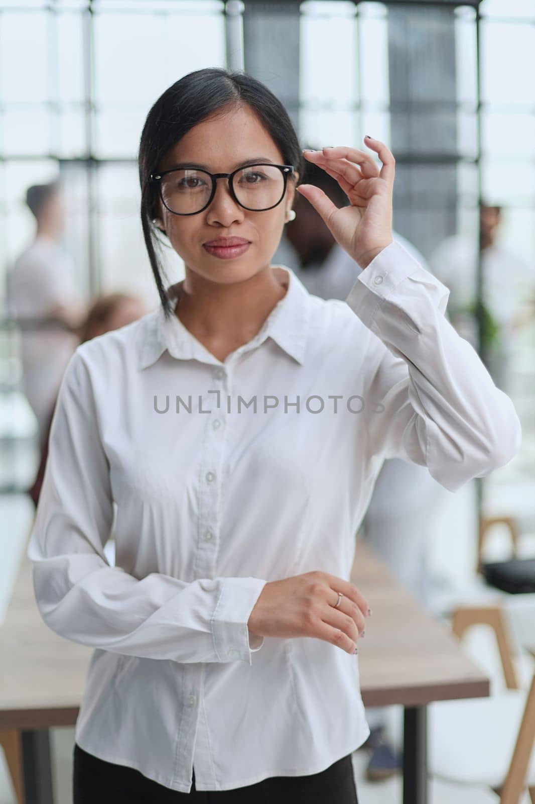 Young beautiful Asian business woman consultant working in the office,