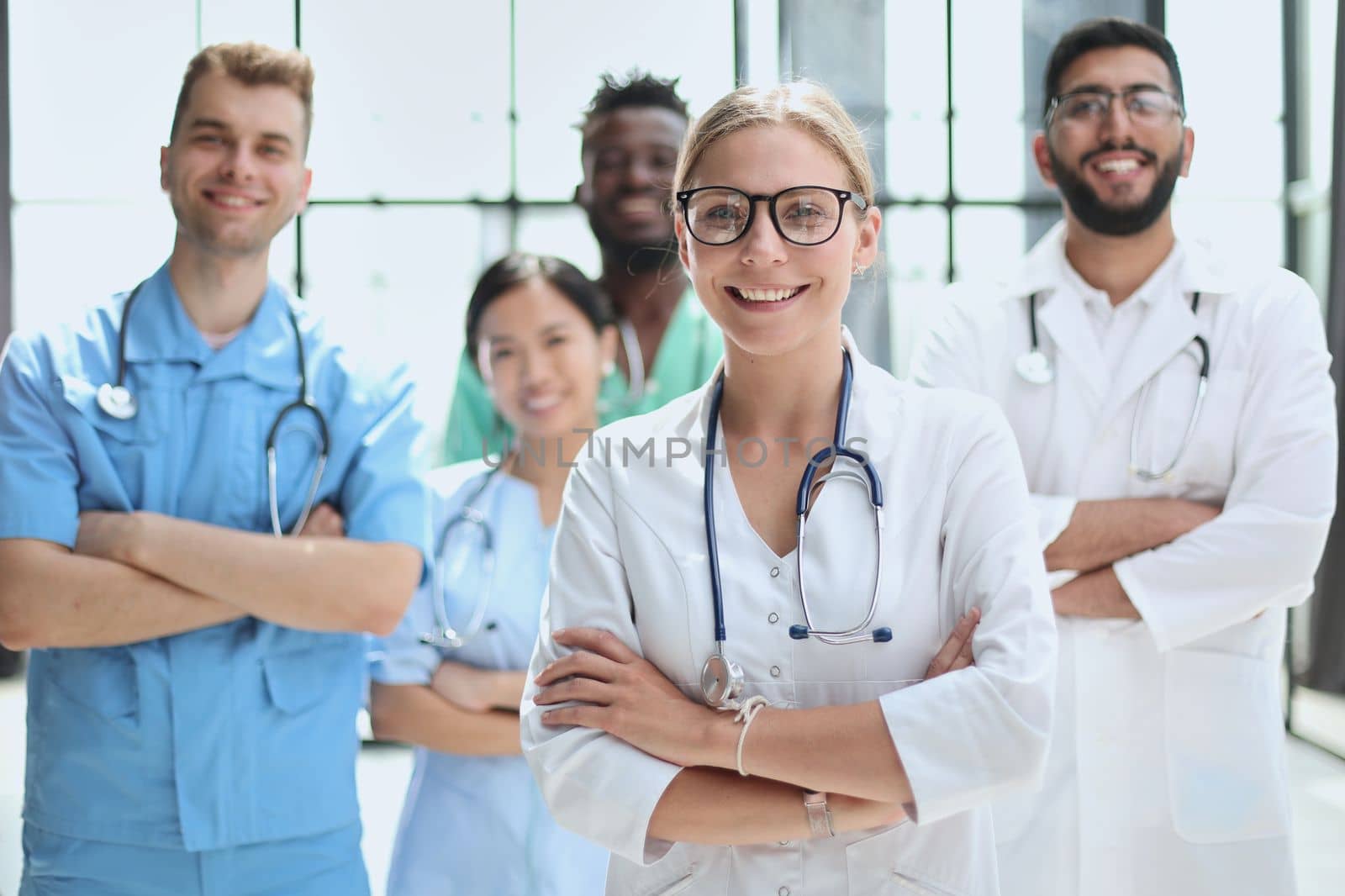 Group of specialists in white overalls at advanced training courses