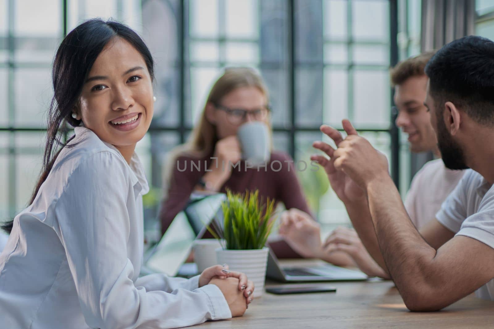 Multi-ethnic group of architects in a meeting