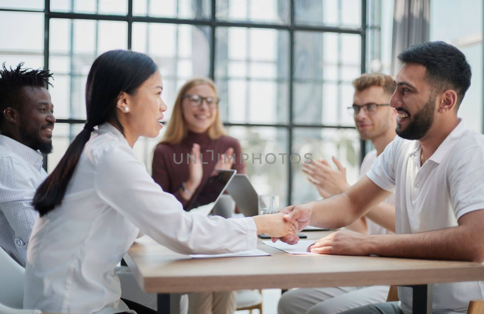 Business people discussing documents and ideas at meeting