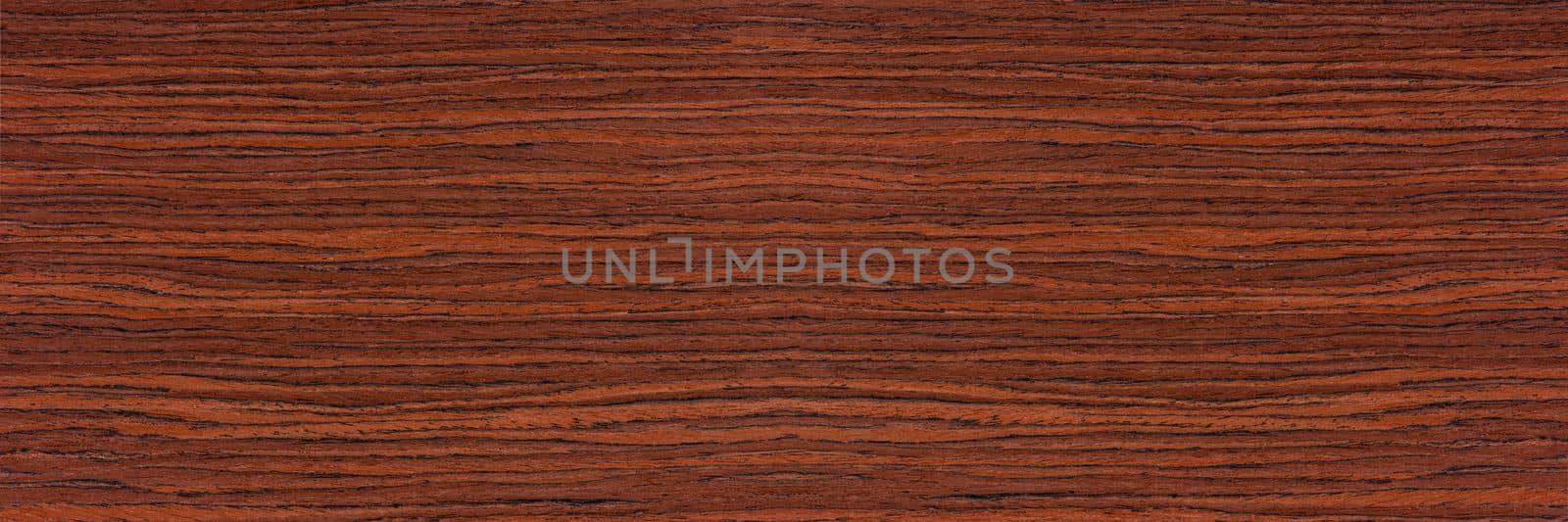 Rosewood texture. Texture of dark mahogany with an intense pattern, natural rosewood veneer for the production of furniture or yacht decoration by SERSOL