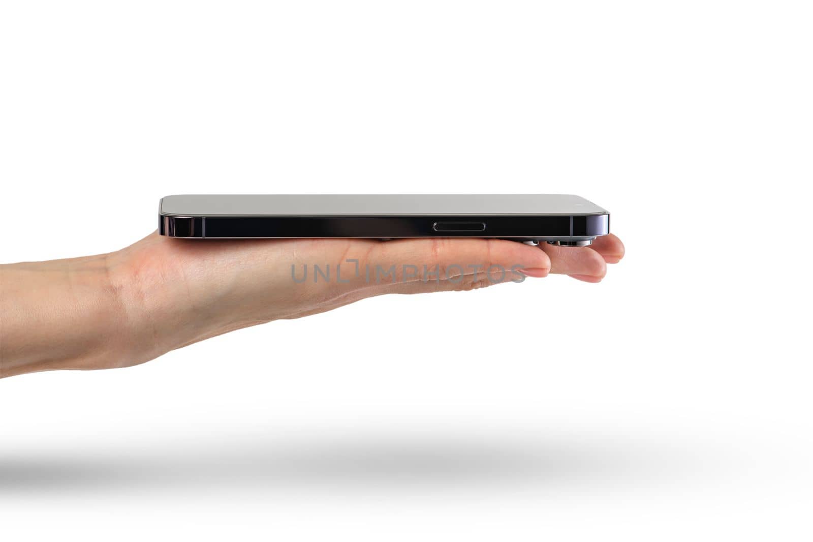 Phone in hand isolate on white background. A modern smartphone lies on the palm with the screen up, side view, mockup for insertion into the project by SERSOL