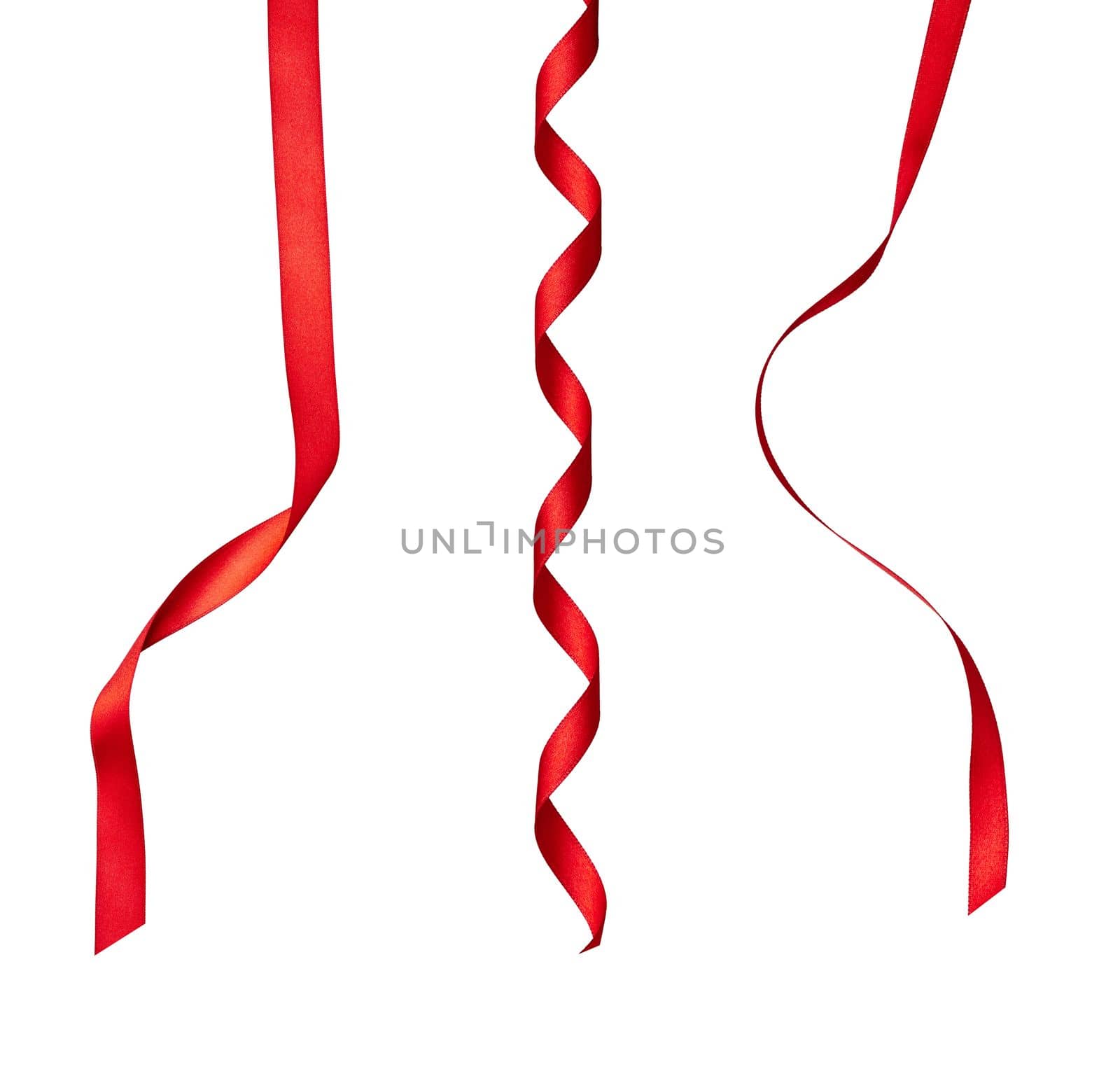 collection of various red ribbon pieces on white background. each one is shot separately