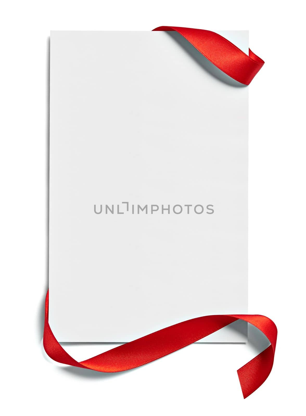 close up of a note card with red ribbon bow on white background