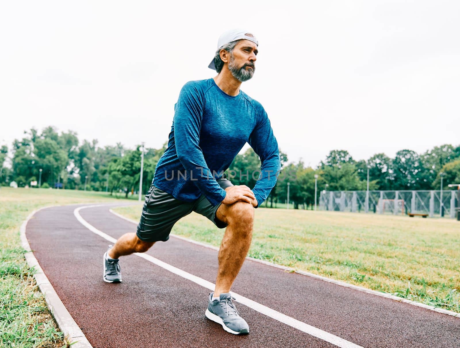 portrait of a senior man exercising and running outdoors