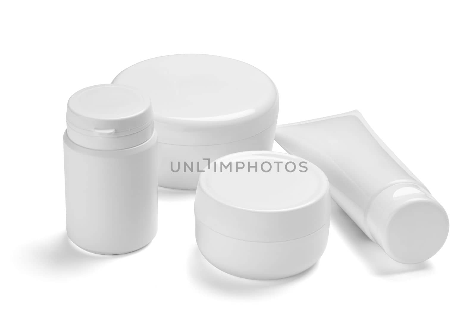 close up of a white beauty cream container and tube on white background