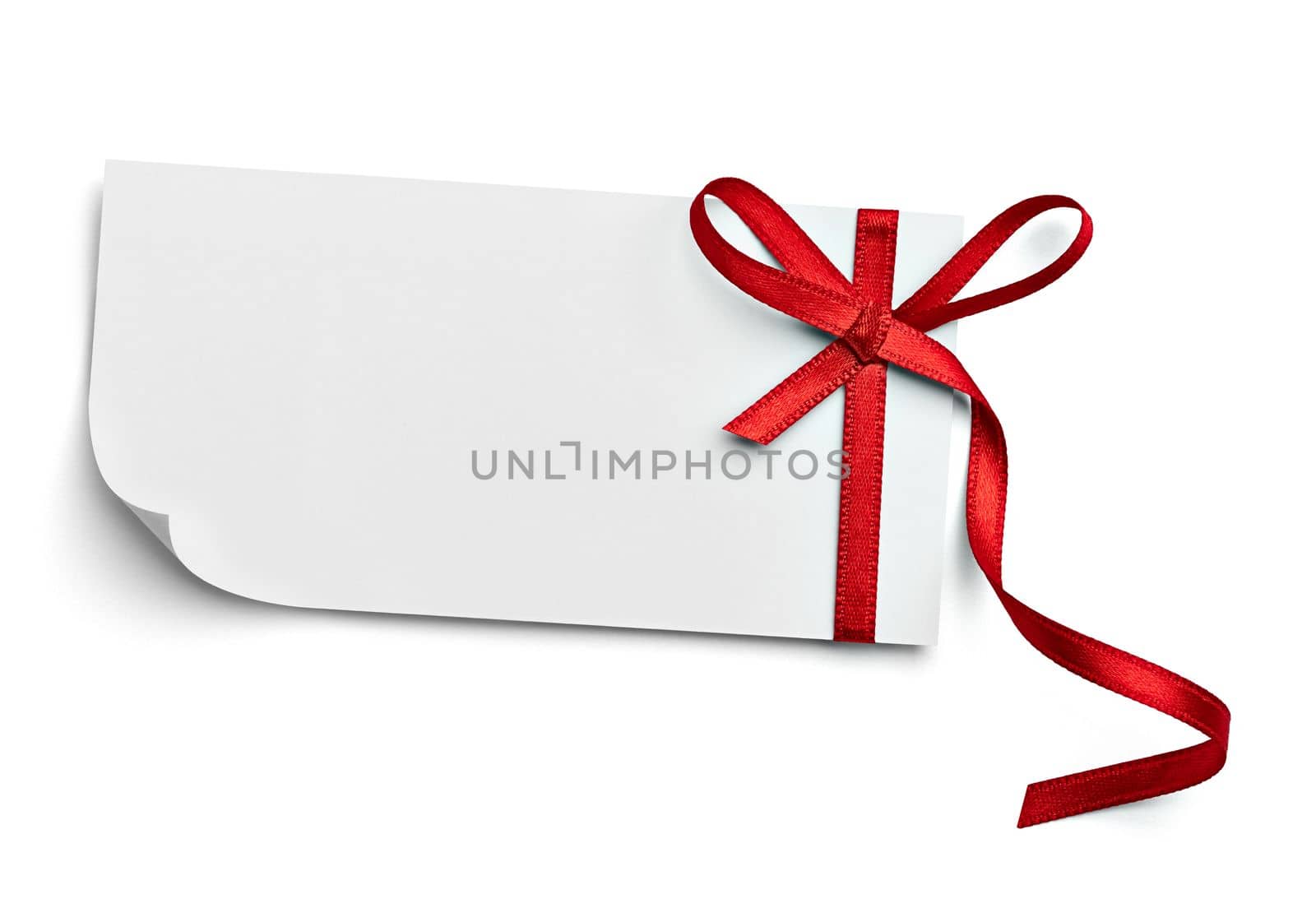close up of a note card with red ribbon bow on white background