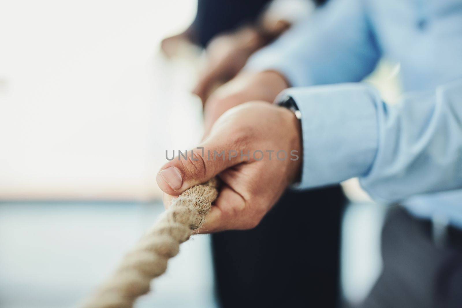 Grab a hold of your goals and keep pulling them closer. Closeup shot of unrecognizable businesspeople pulling on a rope. by YuriArcurs