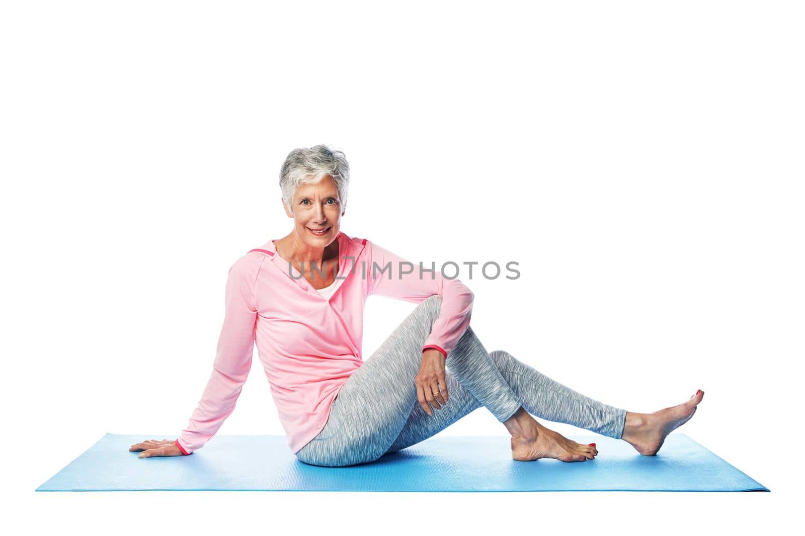 Yoga, portrait and senior woman in studio isolated on a white background. Zen chakra, pilates fitness and retired, elderly and happy female model sitting on mat and training for health and wellness. by YuriArcurs