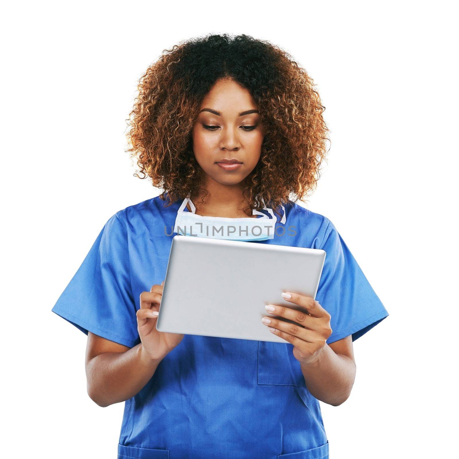 Black woman, doctor and tablet in studio for typing, focus or communication on internet by white background. Isolated nurse, touchscreen tech or reading social media app, article or science news by YuriArcurs