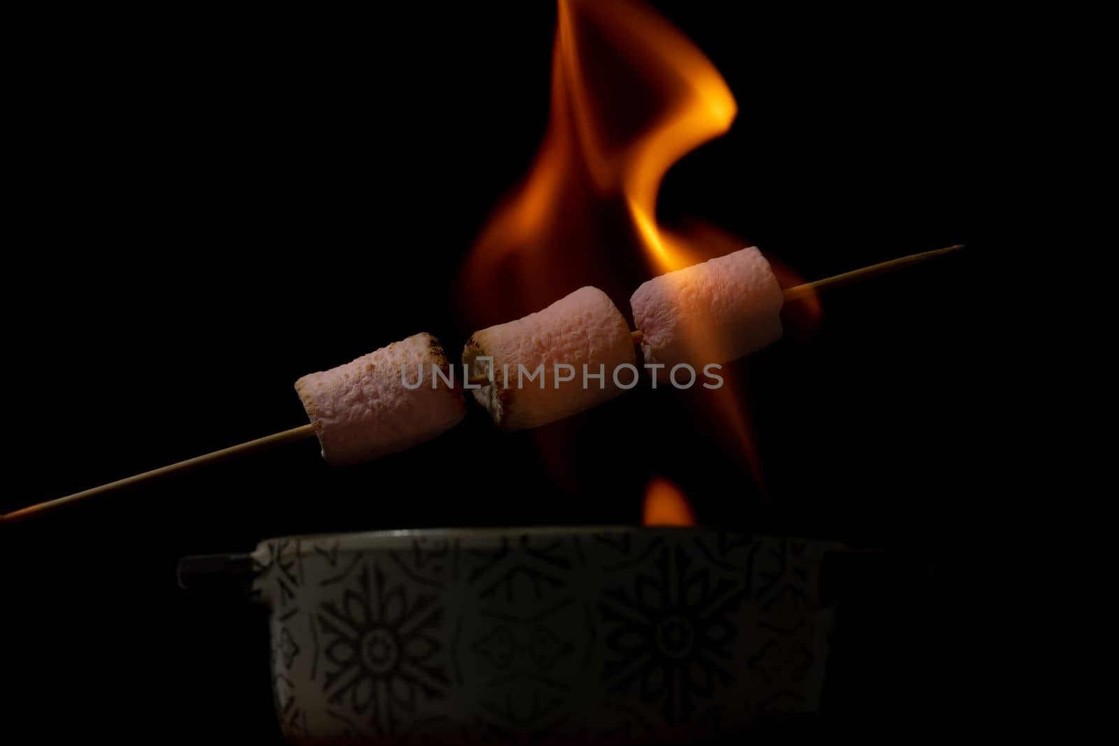 marshmallows skewered sweet on fire by joseantona