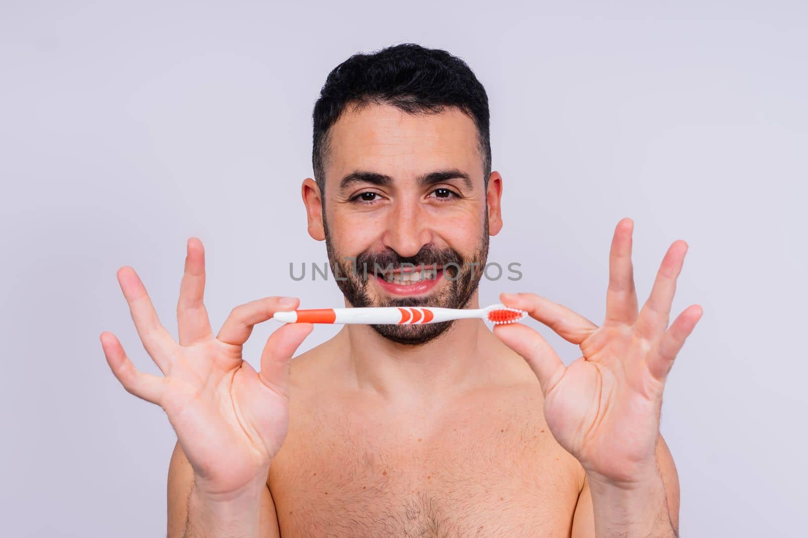 Brush teeth everyday. Masculine model happy to care of oral hygiene, toothbrush, Sanitary conception