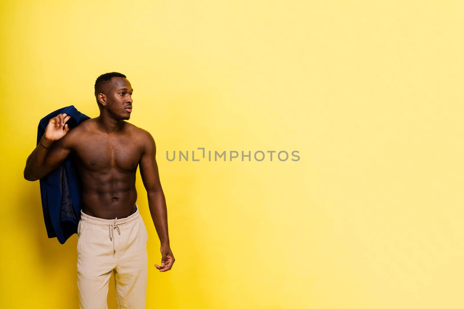 Like what you see. A handsome and muscular young man posing in studio.