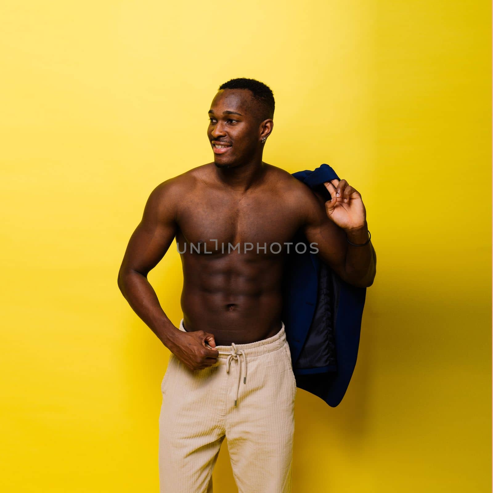 Like what you see. A handsome and muscular young man posing in studio.