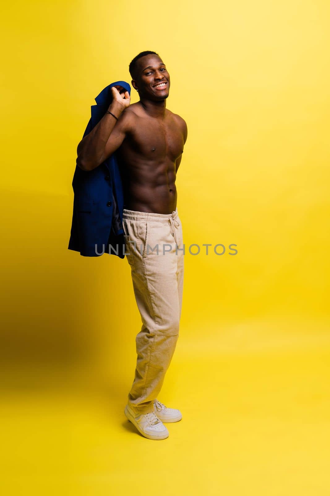 Like what you see. A handsome and muscular young man posing in studio.